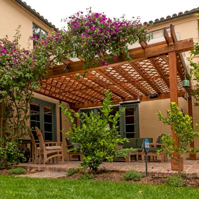 Custom Lattice Pergola Kit (Options: 19' L x 16' W, California Redwood, Electrical Wiring Trim for 2 Posts, 4-Post Kit for Concrete, No Ceiling Fan Base, No Privacy Panels, No Curtain Rods, 9' Post Height, Transparent Premium Sealant). Lattice panels were customized with larger openings than is the standard design. Photo Courtesy of D. Wood of Palo Alto, California.