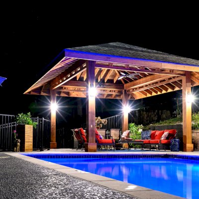 Custom Loreto Pavilion (Options: 26ft x 22ft, Mature Redwood, 11' H Posts, 10 x 10 Posts, 4 Electrical Wiring Trims, 4 Post High-Wind Anchor Kit, 2 Ceiling Fan Bases, No Curtain Rods, Transparent Premium Sealant, with Custom Detail Between Posts). Photo Courtesy of P. Gmerek of Wildwood, Missouri.