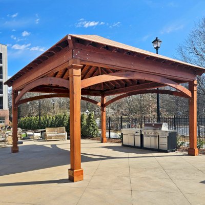 Loreto Pavilion (Options: 20' L x 20' W, 8x8 Posts, No Privacy Panels, Mature Redwood, 10' H, Electrical Wiring Trim for 4 Posts, Post Anchor Kit for High-Wind, Horizontal Post Decorative Trims, 4 Ceiling Fan Bases, No Curtain Rods, Transparent Premium Sealant). Photo Courtesy of D. Loeffel of Atlanta, GA.