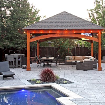 Loreto Pavilion (Options: 20' L x 20' W, 8x8 Posts, No Privacy Panels, California Redwood, 10' H Posts, Electrical Wiring for 2 Posts, 4-Post Anchor Kit for High-Wind, No Post Decorative Trim, 1 Ceiling Fan Base, No Curtain Rods, Transparent Premium Sealant). Photo Courtesy of G. Arruda of Livermore, California.