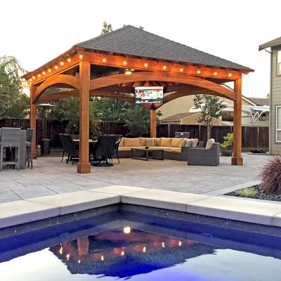 Loreto Pavilion (Options: 20' L x 20' W, 8x8 Posts, No Privacy Panels, California Redwood, 10' H Posts, Electrical Wiring for 2 Posts, 4-Post Anchor Kit for High-Wind, No Post Decorative Trim, 1 Ceiling Fan Base, No Curtain Rods, Transparent Premium Sealant). Photo Courtesy of G. Arruda of Livermore, California.