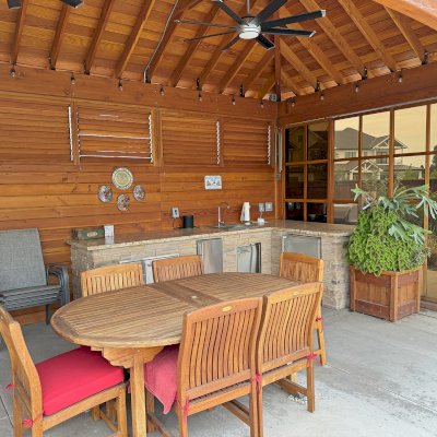 Loreto Pavilion (Options: 25' L x 16' W, 8x8 Posts, Privacy Panels on 3 Sides, Sliding Doors on 2 Sides, Solid Wall with Mobile Louvered Panels Above, Douglas-fir, 9.5' H, Electrical Wiring Trim for 2 Posts, Post Anchor Kit for High-Wind, No Post Decorative Trim, 2 Ceiling Fan Bases, No Curtain Rods, Transparent Premium Sealant). Photo Courtesy of G. Reid of Chico, CA.