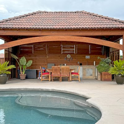 Loreto Pavilion (Options: 25' L x 16' W, 8x8 Posts, Privacy Panels on 3 Sides, Sliding Doors on 2 Sides, Solid Wall with Mobile Louvered Panels Above, Douglas-fir, 9.5' H, Electrical Wiring Trim for 2 Posts, Post Anchor Kit for High-Wind, No Post Decorative Trim, 2 Ceiling Fan Bases, No Curtain Rods, Transparent Premium Sealant). Photo Courtesy of G. Reid of Chico, CA.