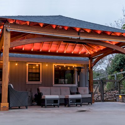 Loreto Pavilion (Options: 24' L x 18' W, 8x8 Posts, No Privacy Panels, California Redwood, 10' H, Electrical Wiring for 1 Post, 4-Post Anchor Kit for Concrete, No Post Decorative Trim, 1 Ceiling Fan Base, 2 Curtain Rods, Transparent Premium Sealant). Photo Courtesy of J. McLauglin of Santa Rosa, California.