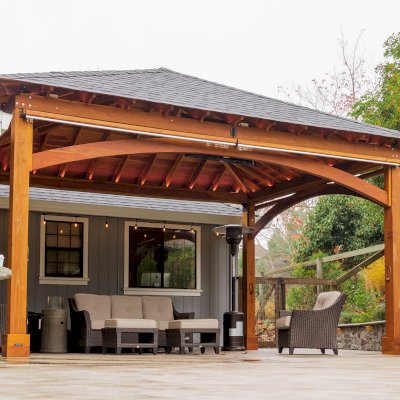 Loreto Pavilion (Options: 24' L x 18' W, 8x8 Posts, No Privacy Panels, California Redwood, 10' H, Electrical Wiring for 1 Post, 4-Post Anchor Kit for Concrete, No Post Decorative Trim, 1 Ceiling Fan Base, 2 Curtain Rods, Transparent Premium Sealant). Photo Courtesy of J. McLauglin of Santa Rosa, California.