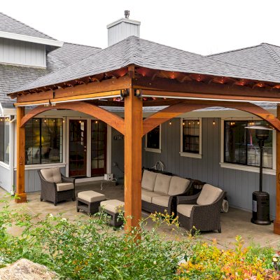 Loreto Pavilion (Options: 24' L x 18' W, 8x8 Posts, No Privacy Panels, California Redwood, 10' H, Electrical Wiring for 1 Post, 4-Post Anchor Kit for Concrete, No Post Decorative Trim, 1 Ceiling Fan Base, 2 Curtain Rods, Transparent Premium Sealant). Photo Courtesy of J. McLauglin of Santa Rosa, California.