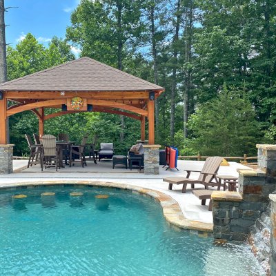Loreto Pavilion (Options: 20' L x 20' W, 8x8 Posts, No Privacy Panels, Douglas-fir, 9.5' H, Electrical Wiring for 1 Post, 4-Post Anchor Kit for High Wind, No Post Decorative Trim, 1 Ceiling Fan Base, No Curtain Rods, Transparent Premium Sealant). Photo Courtesy of Bill & Lori O’Mara of Marion, North Carolina.