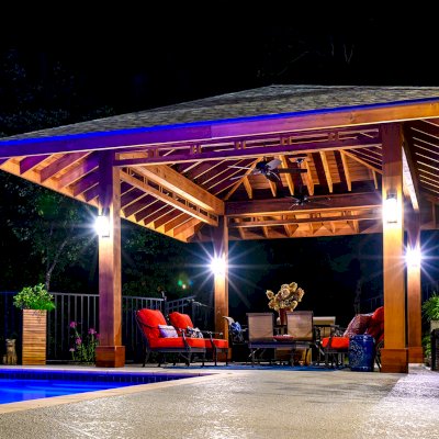 Custom Loreto Pavilion (Options: 26ft x 22ft, Mature Redwood, 11' H Posts, 10 x 10 Posts, 4 Electrical Wiring Trims, 4 Post High-Wind Anchor Kit, 2 Ceiling Fan Bases, No Curtain Rods, Transparent Premium Sealant, with Custom Detail Between Posts). Photo Courtesy of P. Gmerek of Wildwood, Missouri.