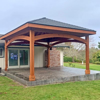Loreto Pavilion (Options: 20' L x 18' W, 8x8 Posts, No Privacy Panels, Mature Redwood, 10' H Posts, 2 Electrical Wiring Trims, 4-Post Anchor Kit for High Wind, No Post Decorative Trims, No Ceiling Fan Base, No Curtain Rods, Transparent Premium Sealant). Photo Courtesy of Frankie & Gary S. of Eureka, California.