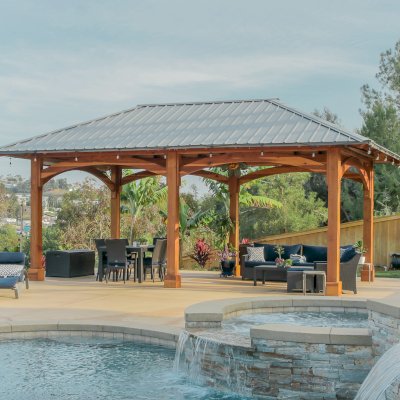 Loreto Pavilion (Options: 26' L x 14' W, 8x8 Posts, No Privacy Panels, California Redwood, 9.5' H, Electrical Wiring for 3 Posts, 6-Post Anchor Kit for High-Wind, No Post Decorative Trim, 2 Ceiling Fan Bases, Transparent Premium Sealant). Photo Courtesy of M. Holmes of Lakeside, CA.