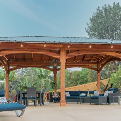 Loreto Pavilion (Options: 26' L x 14' W, 8x8 Posts, No Privacy Panels, California Redwood, 9.5' H, Electrical Wiring for 3 Posts, 6-Post Anchor Kit for High-Wind, No Post Decorative Trim, 2 Ceiling Fan Bases, Transparent Premium Sealant). Photo Courtesy of M. Holmes of Lakeside, CA.