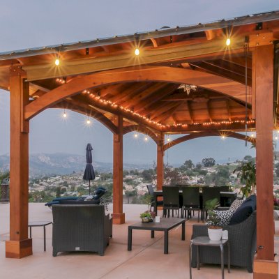Loreto Pavilion (Options: 26' L x 14' W, 8x8 Posts, No Privacy Panels, California Redwood, 9.5' H, Electrical Wiring for 3 Posts, 6-Post Anchor Kit for High-Wind, No Post Decorative Trim, 2 Ceiling Fan Bases, Transparent Premium Sealant). Photo Courtesy of M. Holmes of Lakeside, CA.