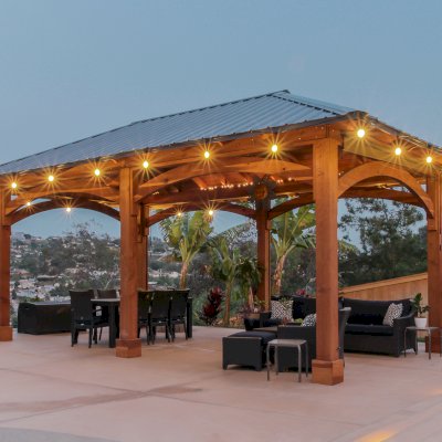 Loreto Pavilion (Options: 26' L x 14' W, 8x8 Posts, No Privacy Panels, California Redwood, 9.5' H, Electrical Wiring for 3 Posts, 6-Post Anchor Kit for High-Wind, No Post Decorative Trim, 2 Ceiling Fan Bases, Transparent Premium Sealant). Photo Courtesy of M. Holmes of Lakeside, CA.