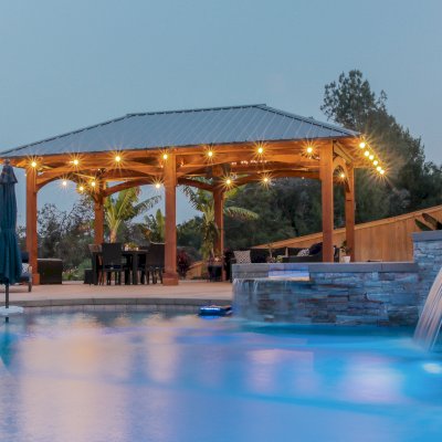 Loreto Pavilion (Options: 26' L x 14' W, 8x8 Posts, No Privacy Panels, California Redwood, 9.5' H, Electrical Wiring for 3 Posts, 6-Post Anchor Kit for High-Wind, No Post Decorative Trim, 2 Ceiling Fan Bases, Transparent Premium Sealant). Photo Courtesy of M. Holmes of Lakeside, CA.