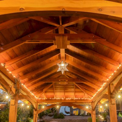 Loreto Pavilion (Options: 26' L x 14' W, 8x8 Posts, No Privacy Panels, California Redwood, 9.5' H, Electrical Wiring for 3 Posts, 6-Post Anchor Kit for High-Wind, No Post Decorative Trim, 2 Ceiling Fan Bases, Transparent Premium Sealant). Photo Courtesy of M. Holmes of Lakeside, CA.