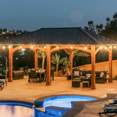 Loreto Pavilion (Options: 26' L x 14' W, 8x8 Posts, No Privacy Panels, California Redwood, 9.5' H, Electrical Wiring for 3 Posts, 6-Post Anchor Kit for High-Wind, No Post Decorative Trim, 2 Ceiling Fan Bases, Transparent Premium Sealant). Photo Courtesy of M. Holmes of Lakeside, CA.