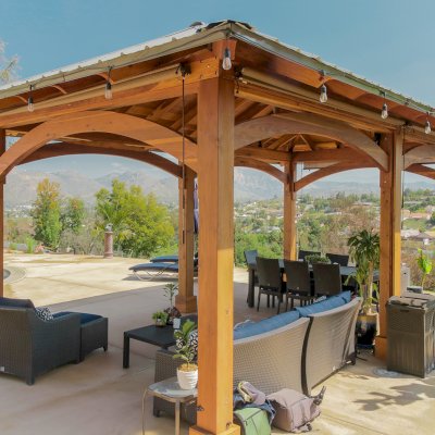 Loreto Pavilion (Options: 26' L x 14' W, 8x8 Posts, No Privacy Panels, California Redwood, 9.5' H, Electrical Wiring for 3 Posts, 6-Post Anchor Kit for High-Wind, No Post Decorative Trim, 2 Ceiling Fan Bases, Transparent Premium Sealant). Photo Courtesy of M. Holmes of Lakeside, CA.