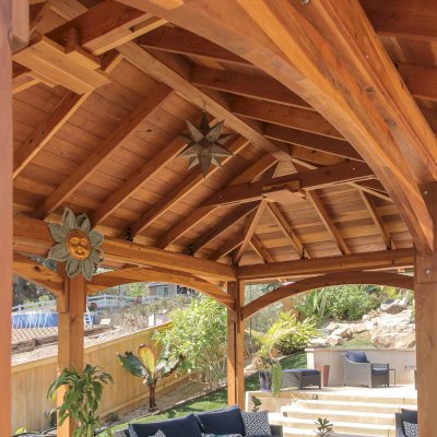 Loreto Pavilion (Options: 26' L x 14' W, 8x8 Posts, No Privacy Panels, California Redwood, 9.5' H, Electrical Wiring for 3 Posts, 6-Post Anchor Kit for High-Wind, No Post Decorative Trim, 2 Ceiling Fan Bases, Transparent Premium Sealant). Photo Courtesy of M. Holmes of Lakeside, CA.