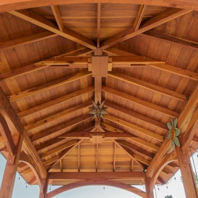 Loreto Pavilion (Options: 26' L x 14' W, 8x8 Posts, No Privacy Panels, California Redwood, 9.5' H, Electrical Wiring for 3 Posts, 6-Post Anchor Kit for High-Wind, No Post Decorative Trim, 2 Ceiling Fan Bases, Transparent Premium Sealant). Photo Courtesy of M. Holmes of Lakeside, CA.