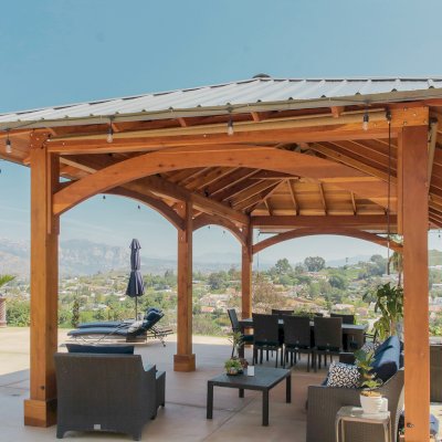 Loreto Pavilion (Options: 26' L x 14' W, 8x8 Posts, No Privacy Panels, California Redwood, 9.5' H, Electrical Wiring for 3 Posts, 6-Post Anchor Kit for High-Wind, No Post Decorative Trim, 2 Ceiling Fan Bases, Transparent Premium Sealant). Photo Courtesy of M. Holmes of Lakeside, CA.