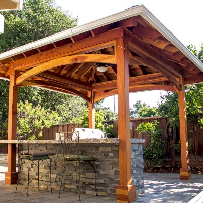 Loreto Pavilion (Options: 14' x 14', 6x6 Posts, California Redwood, 4-Post Anchor Kit for High-Wind, 1 Electrical Wiring Trim Kit, 2ft Overhangs by Custom Request, Transparent Premium Sealant). Gutters added by Forever Redwood install team and can be added to any pavilion by request. Photo Courtesy of B. Hirschbeck of Los Altos, CA.