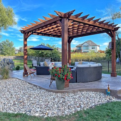 Montvale Pergolas (Options: 16' x 16', Douglas-fir, 10 ft H, 1 Ceiling Fan Base, No Post Decorative Trims, Coffee-Stain Premium Sealant). Photo Courtesy of Billy & Brianne Foster of Olathe, KS.