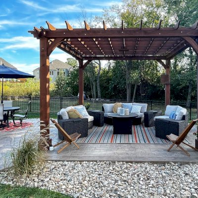 Montvale Pergolas (Options: 16' x 16', Douglas-fir, 10 ft H, 1 Ceiling Fan Base, No Post Decorative Trims, Coffee-Stain Premium Sealant). Photo Courtesy of Billy & Brianne Foster of Olathe, KS.