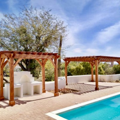 Montvale Pergolas (Options: 14' x 8' & 20' x 16', Douglas-fir, Electrical Wiring Trim for 1 Post, Rafters at 16", 4-Post Anchor Kit for High-Wind, No Ceiling Fan Base, No Privacy Panels, 10' Post, Transparent Premium Sealant). Photo courtesy of M. Simpson of Tucson, Arizona.