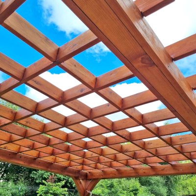 Montvale Pergola (Options: 20' x 14', Mature Redwood, 4-Post Anchor Kit for Concrete, No Ceiling Fan Base, No Curtain Rods, No Privacy Panels, 9' H Posts, Transparent Premium Sealant). Photo Courtesy of R. Greenfield of Gig Harbor, Washington.