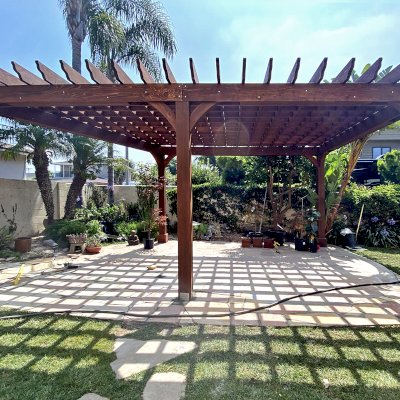 Custom Montvale Pergola (Options: Irregular Shape That is 14' x 16' on 2 Adjacent Sides, But the Side Opposite the 16' was Extended to 22' and Have a 5th Post, California Redwood, 9.5' Posts, Coffee-Stain Premium Sealant). Photo Courtesy of G. Tanaka of Torrance, CA.