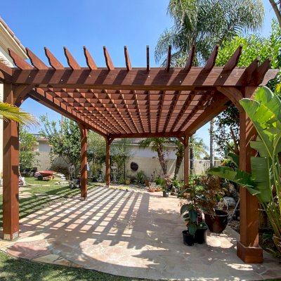 Custom Montvale Pergola (Options: Irregular Shape That is 14' x 16' on 2 Adjacent Sides, But the Side Opposite the 16' was Extended to 22' and Have a 5th Post, California Redwood, 9.5' Posts, Coffee-Stain Premium Sealant). Photo Courtesy of G. Tanaka of Torrance, CA.
