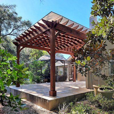 Custom Attached Montvale Pergola (Options: 26' x 18', California Redwood, 12' Posts, with Rain Guard, Coffee-Stain Premium Sealant). Photo Courtesy of D. Fournier of Valrico, FL.