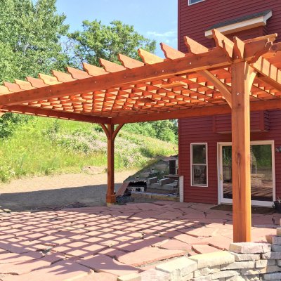 Montvale Pergolas (Options: 24' x 18', California Redwood, 4-Post Anchor Kit for High-Wind, Pergola with Only 4 Posts Instead of 6 by Custom Request, 5 Ceiling Fan Bases, No Curtain Rods, No Privacy Panels, 10.5' Post, Transparent Premium Sealant). Photo Courtesy of M. Lockheart of Hudson, WI.