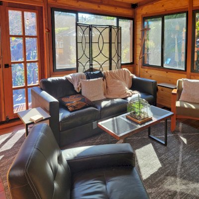 Palo Alto Backyard Cabin (Options: 18' L, 16' W, Without Porch, Structural Deck - Interior and 4' Exterior, California Redwood, Sugar Pine Internal Walls and Ceiling, Windows Purchased Locally, With Two 3' x 5' Skylights, Metal Roof, Custom Railings and Steps, Electrical Wire Trim on the Walls, Transparent Premium Sealant). Photo Courtesy of A. Ramon of South San Francisco, California.