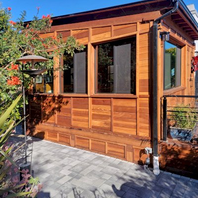 Palo Alto Backyard Cabin (Options: 18' L, 16' W, Without Porch, Structural Deck - Interior and 4' Exterior, California Redwood, Sugar Pine Internal Walls and Ceiling, Windows Purchased Locally, With Two 3' x 5' Skylights, Metal Roof, Custom Railings and Steps, Electrical Wire Trim on the Walls, Transparent Premium Sealant). Photo Courtesy of A. Ramon of South San Francisco, California.