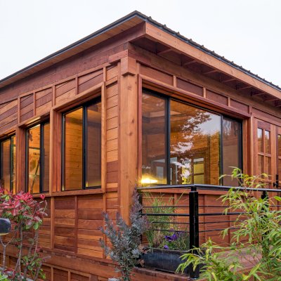 Palo Alto Backyard Cabin (Options: 18' L, 16' W, Without Porch, Structural Deck - Interior and 4' Exterior, California Redwood, Sugar Pine Internal Walls and Ceiling, Windows Purchased Locally, With Two 3' x 5' Skylights, Metal Roof, Custom Railings and Steps, Electrical Wire Trim on the Walls, Transparent Premium Sealant). Photo Courtesy of A. Ramon of South San Francisco, California.