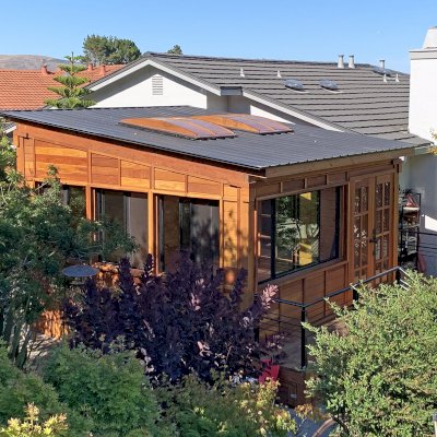 Palo Alto Backyard Cabin (Options: 18' L, 16' W, Without Porch, Structural Deck - Interior and 4' Exterior, California Redwood, Sugar Pine Internal Walls and Ceiling, Windows Purchased Locally, With Two 3' x 5' Skylights, Metal Roof, Custom Railings and Steps, Electrical Wire Trim on the Walls, Transparent Premium Sealant). Photo Courtesy of A. Ramon of South San Francisco, California.