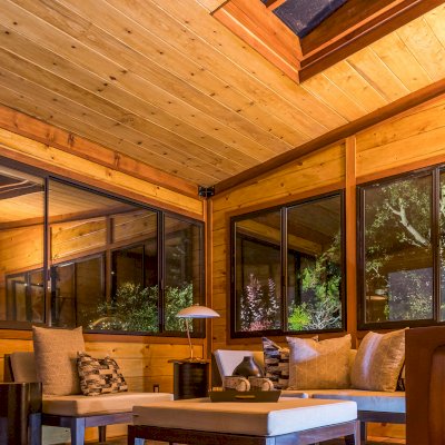 Palo Alto Backyard Cabin (Options: 18' L, 16' W, Without Porch, Structural Deck - Interior and 4' Exterior, California Redwood, Sugar Pine Internal Walls and Ceiling, Windows Purchased Locally, With Two 3' x 5' Skylights, Metal Roof, Custom Railings and Steps, Electrical Wire Trim on the Walls, Transparent Premium Sealant). Photo Courtesy of A. Ramon of South San Francisco, California.