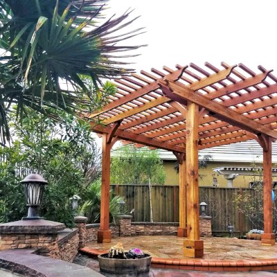 Round Pergola (Options: 16' Diameter, No Privacy Panel, California Redwood, Open Roof Slats at 6", 9.5ft Post Height, Include Electrical Wiring Trim for 2 Posts, 4-Post Anchor Kit for Stone, No Post Decorative Trim, No Ceiling Fan Base, No Curtain Rods, Transparent Premium Sealant). Photo courtesy of Harish B. of Dublin, CA