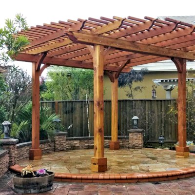 Round Pergola (Options: 16' Diameter, No Privacy Panel, California Redwood, Open Roof Slats at 6", 9.5ft Post Height, Include Electrical Wiring Trim for 2 Posts, 4-Post Anchor Kit for Stone, No Post Decorative Trim, No Ceiling Fan Base, No Curtain Rods, Transparent Premium Sealant). Photo courtesy of Harish B. of Dublin, CA