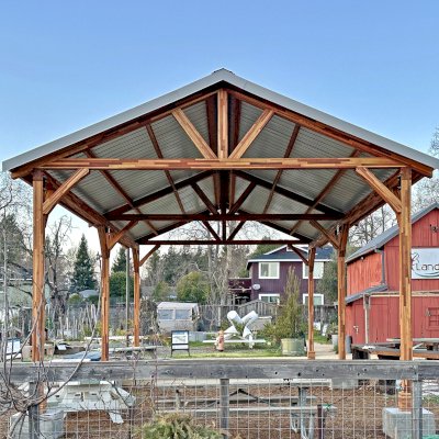 San Carlos Carport Pavilion (Options: 40' L x 20' W, Mosaic Redwood, 6- Post Stainless Steel High Wind Anchor Kit, 10' H Posts, 6x6 Posts, Electrical Wiring Trim Kit for 1 Post, Transparent Premium Sealant). Order installed at Bayer Park Gardens, 1550 West Ave. Santa Rosa, CA.
