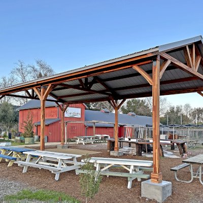 San Carlos Carport Pavilion (Options: 40' L x 20' W, Mosaic Redwood, 6- Post Stainless Steel High Wind Anchor Kit, 10' H Posts, 6x6 Posts, Electrical Wiring Trim Kit for 1 Post, Transparent Premium Sealant). Order installed at Bayer Park Gardens, 1550 West Ave. Santa Rosa, CA.
