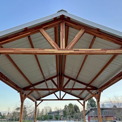 San Carlos Carport Pavilion (Options: 40' L x 20' W, Mosaic Redwood, 6- Post Stainless Steel High Wind Anchor Kit, 10' H Posts, 6x6 Posts, Electrical Wiring Trim Kit for 1 Post, Transparent Premium Sealant). Order installed at Bayer Park Gardens, 1550 West Ave. Santa Rosa, CA.