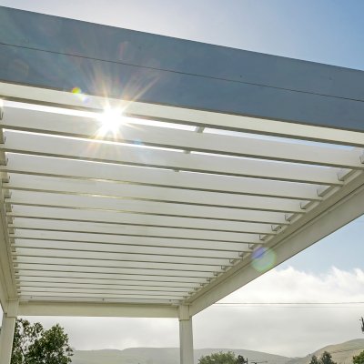 Silverado Modern Pergola (Options: 20' L, 10' W, Standard Roof Style, 12" Roof Rafter Spacing, Mosaic Redwood,  4-Post Anchor kit for Concrete, White Primer). 