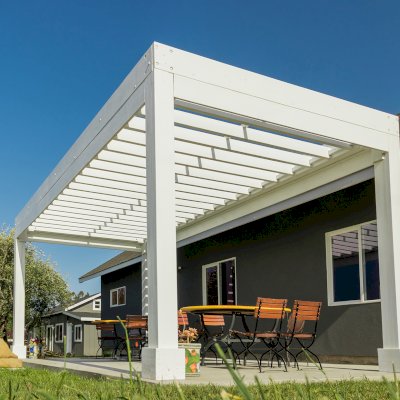 Silverado Modern Pergola (Options: 20' L, 10' W, Standard Roof Style, 12" Roof Rafter Spacing, Mosaic Redwood,  4-Post Anchor kit for Concrete, White Primer). 