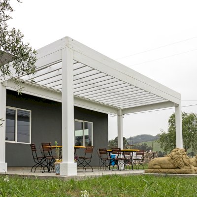 Silverado Modern Pergola (Options: 20' L, 10' W, Standard Roof Style, 12" Roof Rafter Spacing, Mosaic Redwood,  4-Post Anchor kit for Concrete, White Primer). 