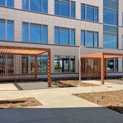 Silverado Modern Pergolas (Options: 16' L, 16' W, Standard Roof Style, 8" Roof Rafter Spacing, California Redwood,  10.5' H Posts, 4-Post Anchor kit for Concrete, with 1 Custom Panel, Transparent Premium Sealant). Photo Courtesy of S. Barragan of Milpitas, California.