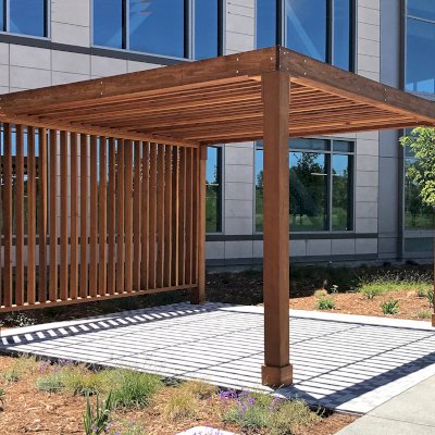 Silverado Modern Pergola (Options: 16' L, 16' W, Standard Roof Style, 8" Roof Rafter Spacing, California Redwood,  10.5' H Posts, 4-Post Anchor kit for Concrete, with 1 Custom Panel, Transparent Premium Sealant). Photo Courtesy of S. Barragan of Milpitas, California.
