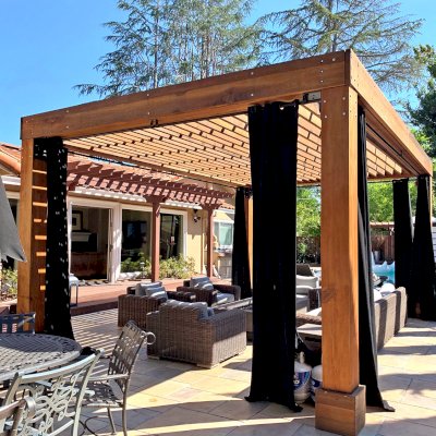 Silverado Modern Pergola (Options: 7 1/4" x 7 1/4" Post Thickness, Standard Roof Style, 20'L x 14'W, No Privacy Panels, California Redwood, No Rain Guard, 9ft Post Height, No Electrical Wiring Trim, 4 Post Anchor Kit for Concrete, 4 Curtain Rods, No Ceiling Fan Base, Transparent Premium Sealant). Photo Courtesy of B. Walsh of Atherton, California.