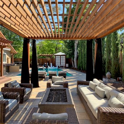 Silverado Modern Pergola (Options: 7 1/4" x 7 1/4" Post Thickness, Standard Roof Style, 20'L x 14'W, No Privacy Panels, California Redwood, No Rain Guard, 9ft Post Height, No Electrical Wiring Trim, 4 Post Anchor Kit for Concrete, 4 Curtain Rods, No Ceiling Fan Base, Transparent Premium Sealant). Photo Courtesy of B. Walsh of Atherton, California.